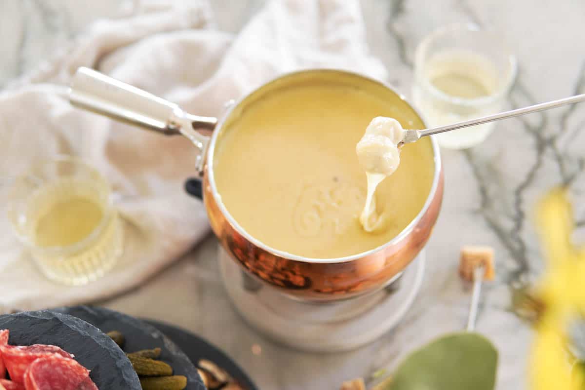 Swiss cheese fondue in a copper pot