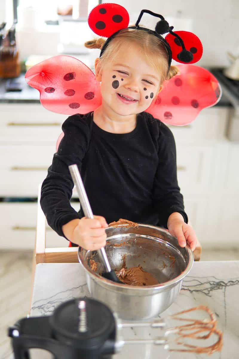 child stirring cake batter
