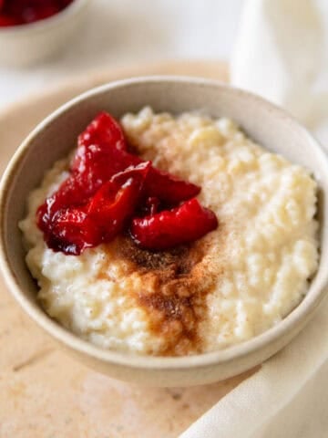 Easy rice pudding topped with stewed plums.