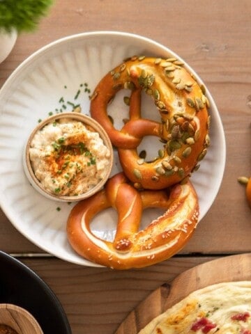plate with pretzels and Obatzda cheese dip