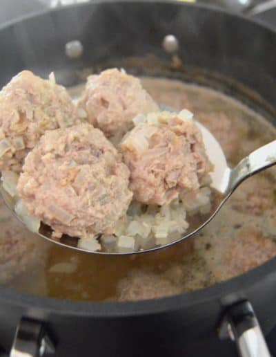 Skimming Meatballs from Broth Königsberger Klopse German Meatball Recipe