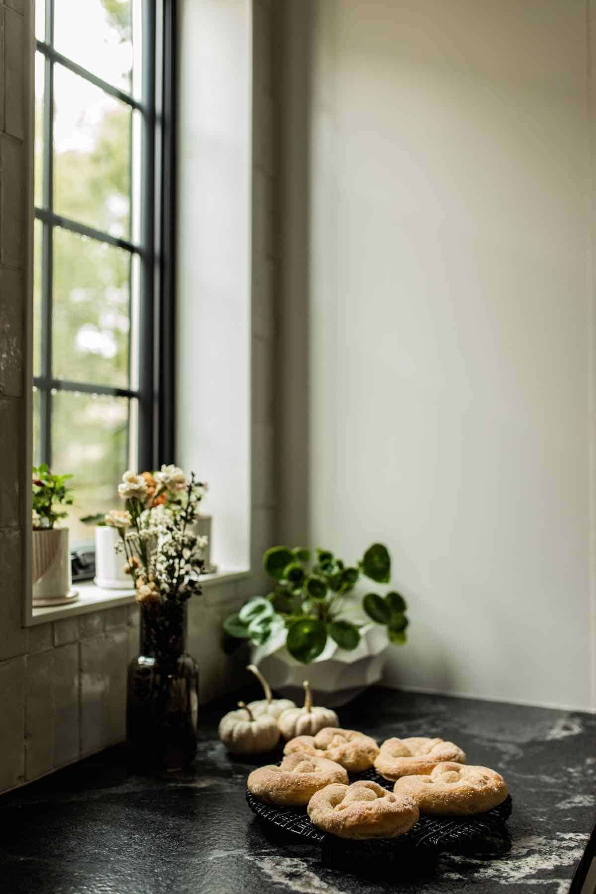 baked Martinsbrezeln sitting on the counter by a window