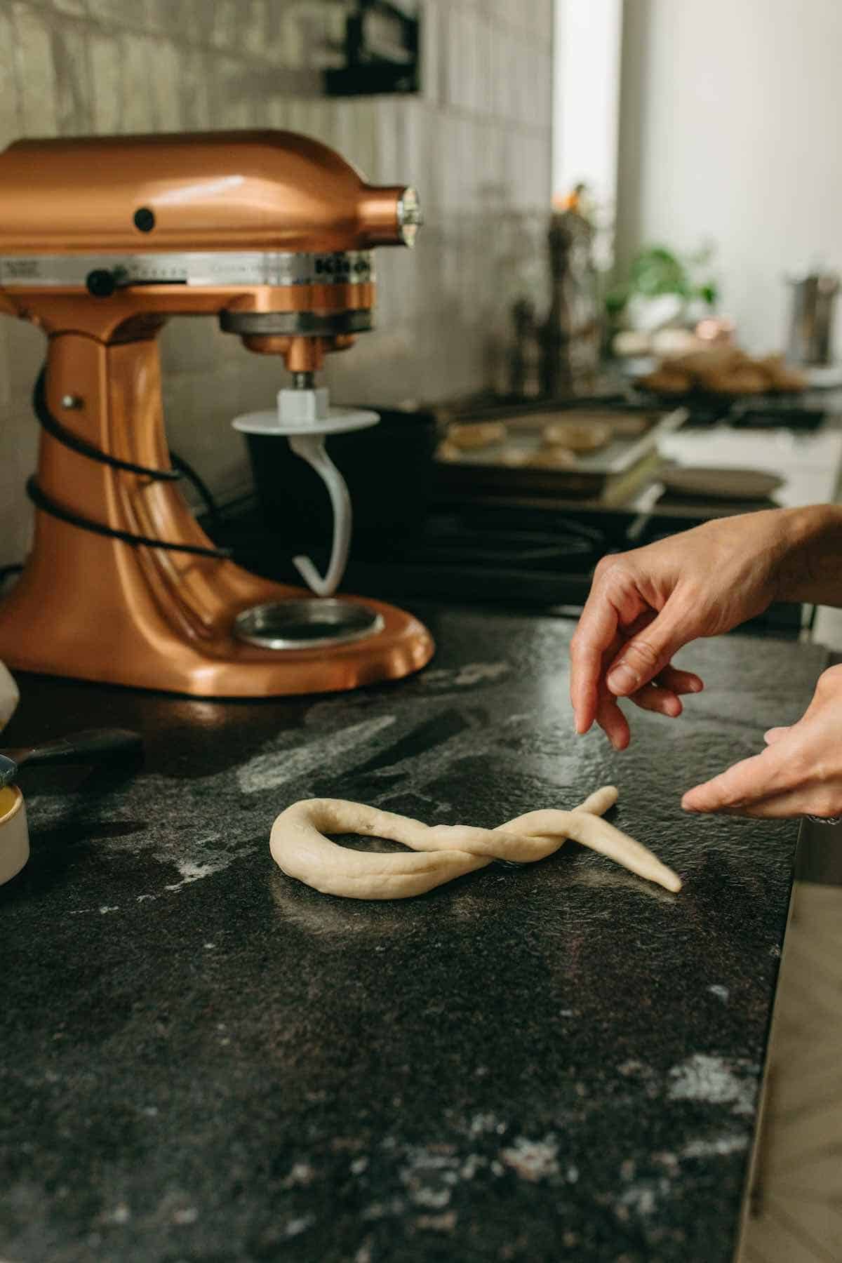 shaping German pretzels