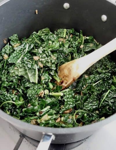 Sautéing kale with bacon and onion
