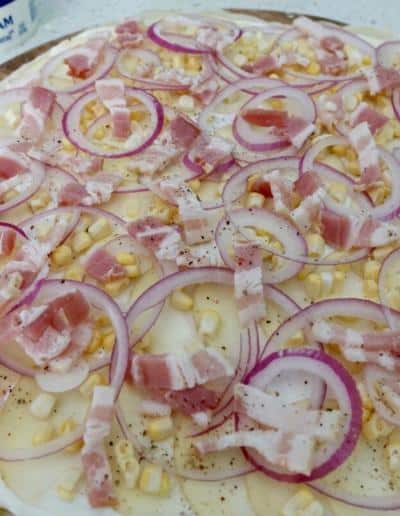 Flammkuchen ready to hit the 500 degree oven!