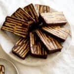 Slices of Kalter Hund chocolate cookie cake on a platter