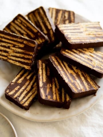 Slices of Kalter Hund chocolate cookie cake on a platter