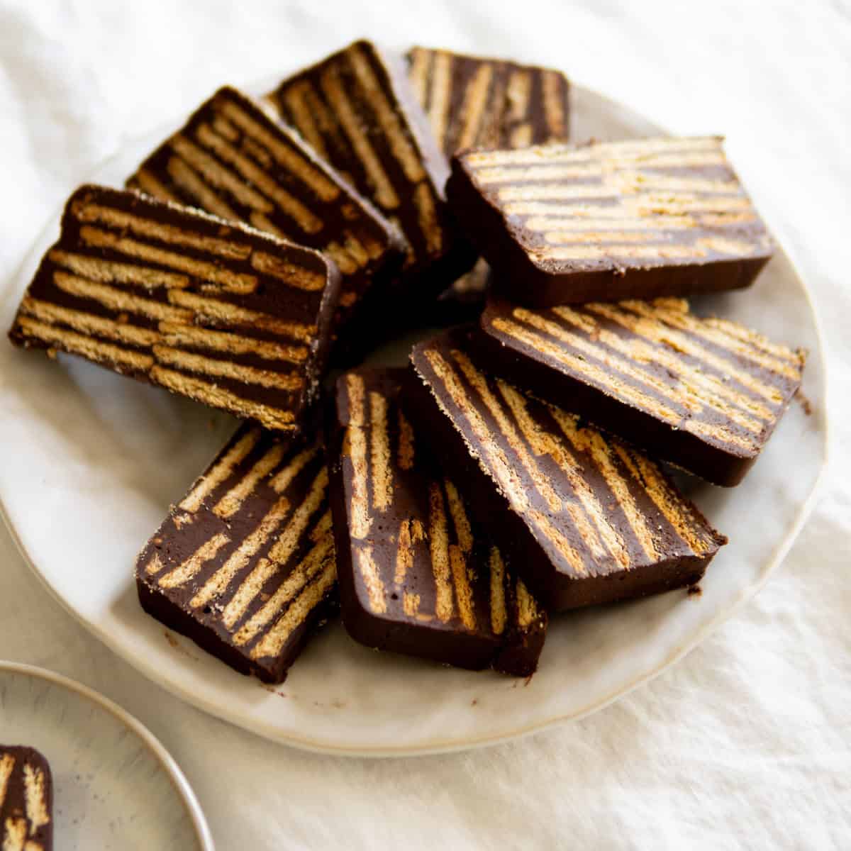Slices of Kalter Hund chocolate cookie cake on a platter