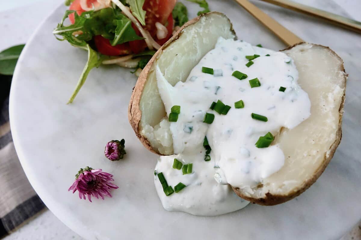 Ofenkartoffel German Baked Potato arranged with Horseradish Herb Quark and Tomato Arugula Salad