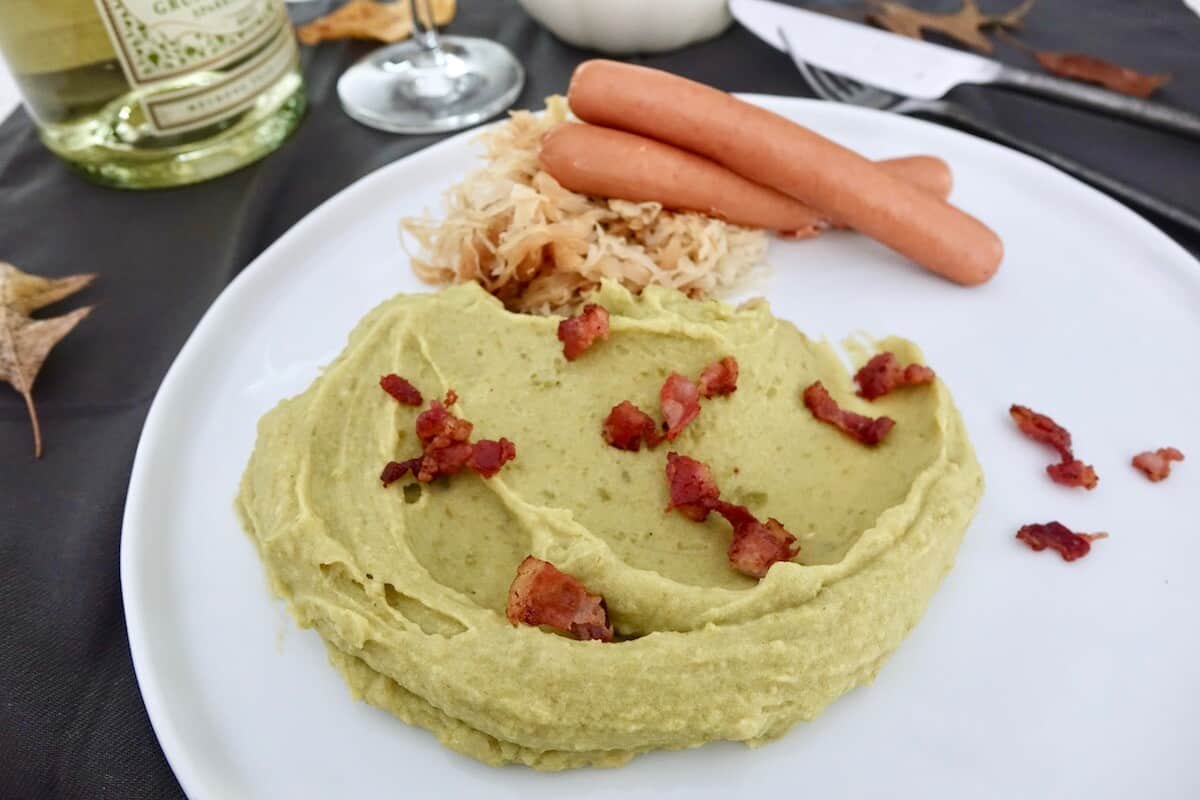 German Mashed Peas & Potato Puree aka Erbsbrei Served with Sauerkraut and Sausages