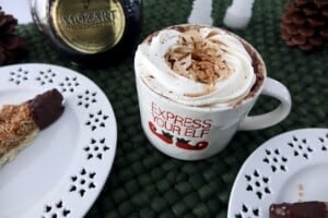 Hot chocolate in Elf mug with whipped cream and Mozart liqueur