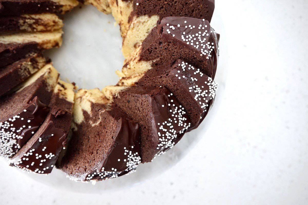 Marmorkuchen baked with dark chocolate glaze and sprinkles