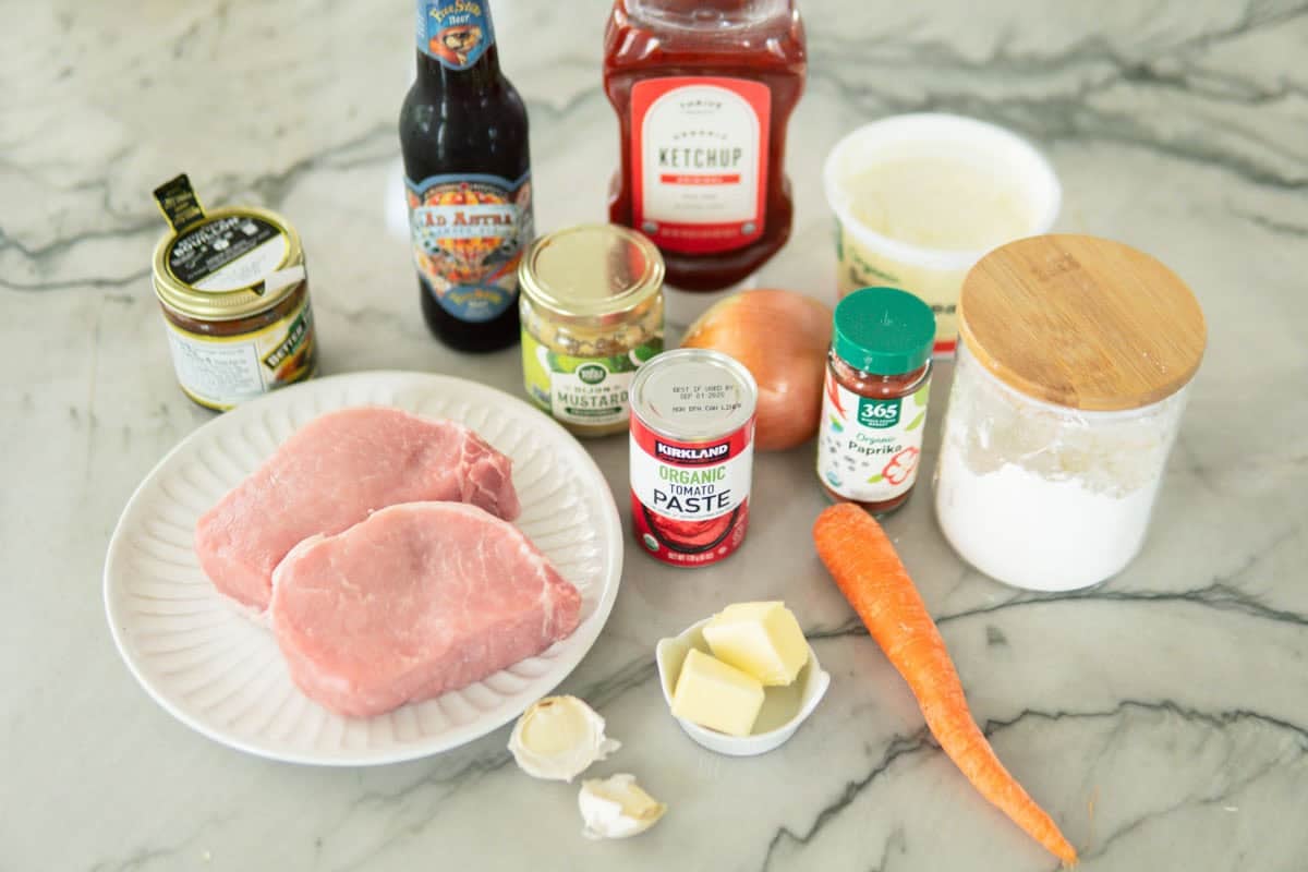Ingredients for German pork goulash cooked in beer sauce.