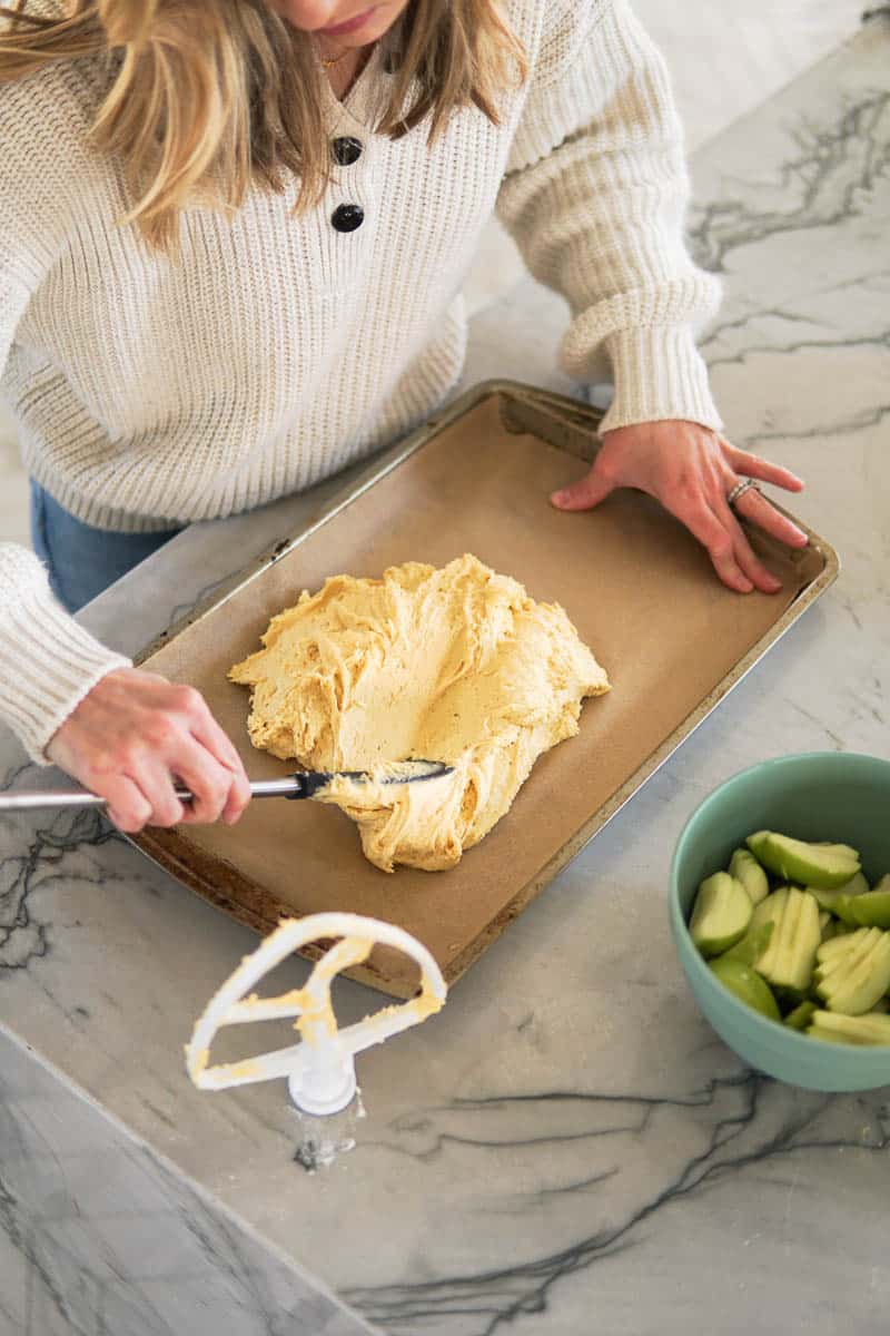 spreading cake batter on a sheet pan