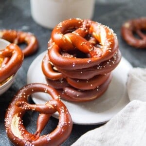 A stack of German pretzels on a plate.