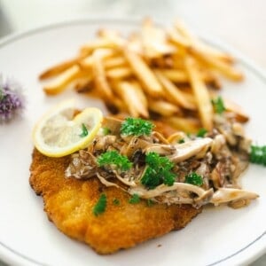 Jägerschnitzel sauce over schnitzel with fries