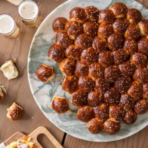 pretzel beer bubble bread sitting on a marble platter