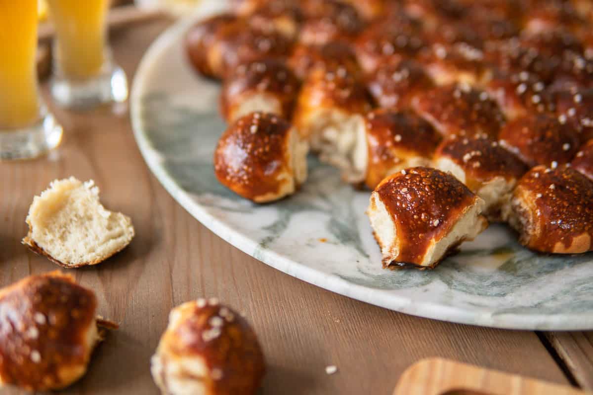 pieces of pretzel beer bread torn off and scattered on the table