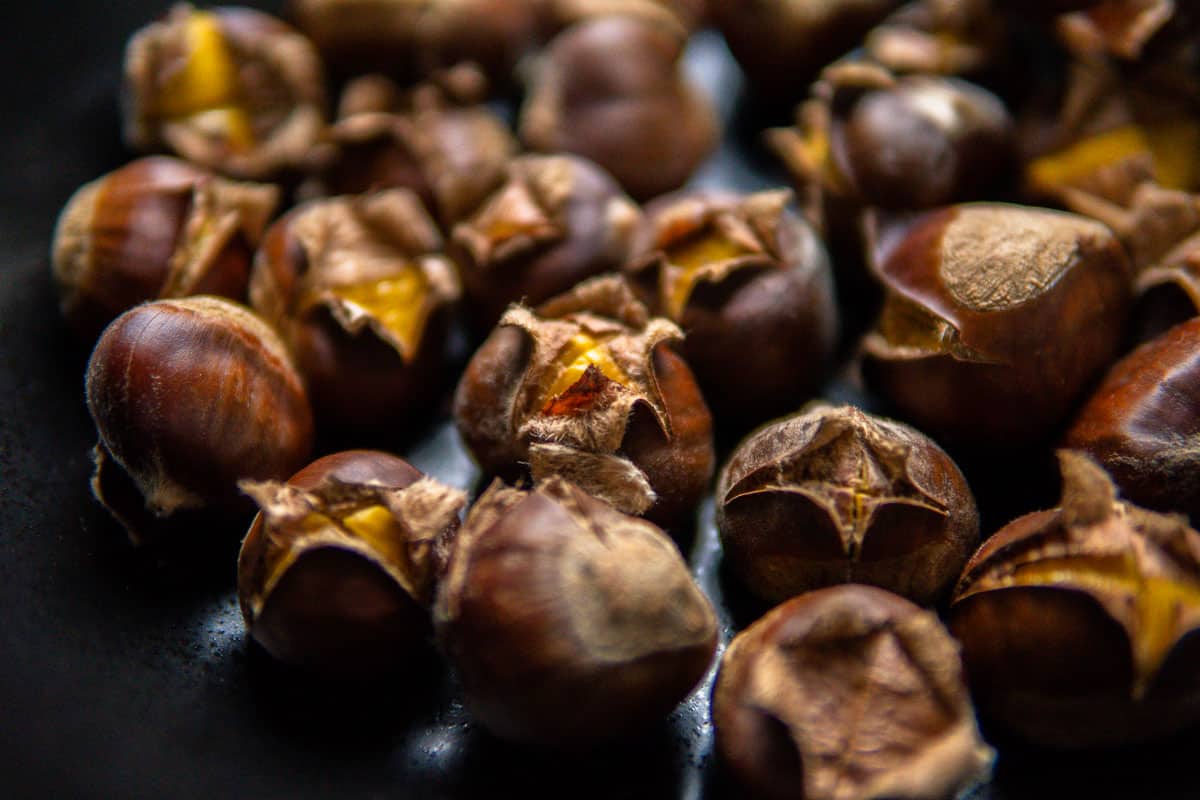 closeup of roasted chestnuts in shell