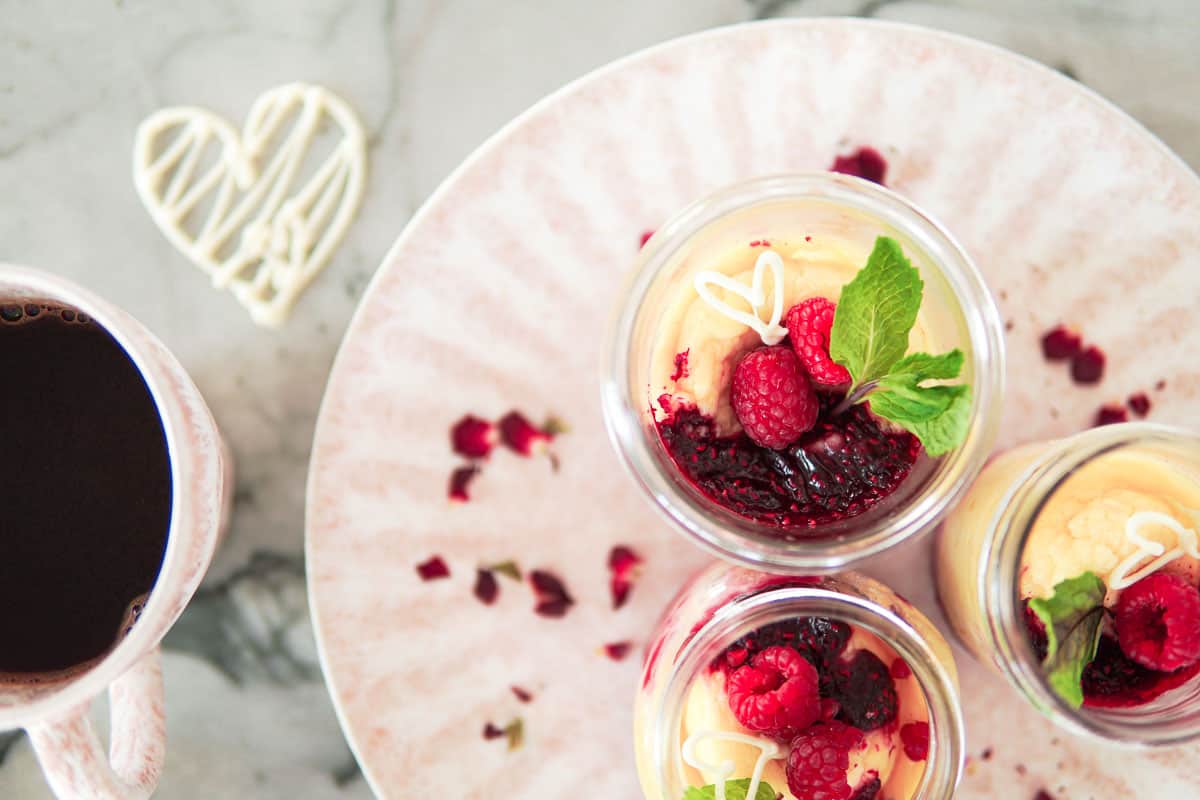 plate with German cheesecake baked in jars