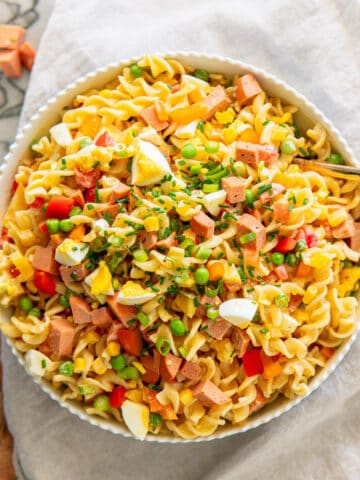 a large bowl of creamy pasta salad