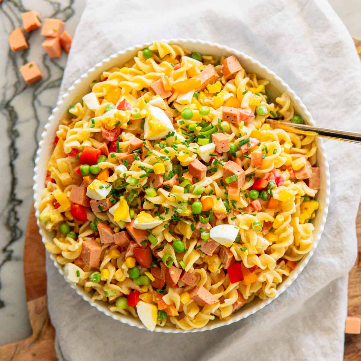 a large bowl of creamy pasta salad