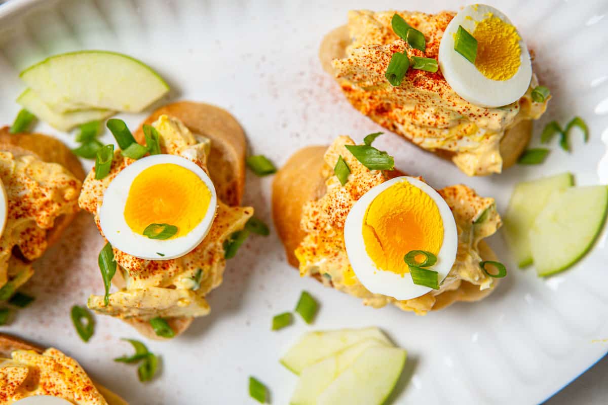 closeup of healthy egg salad on baguette slices