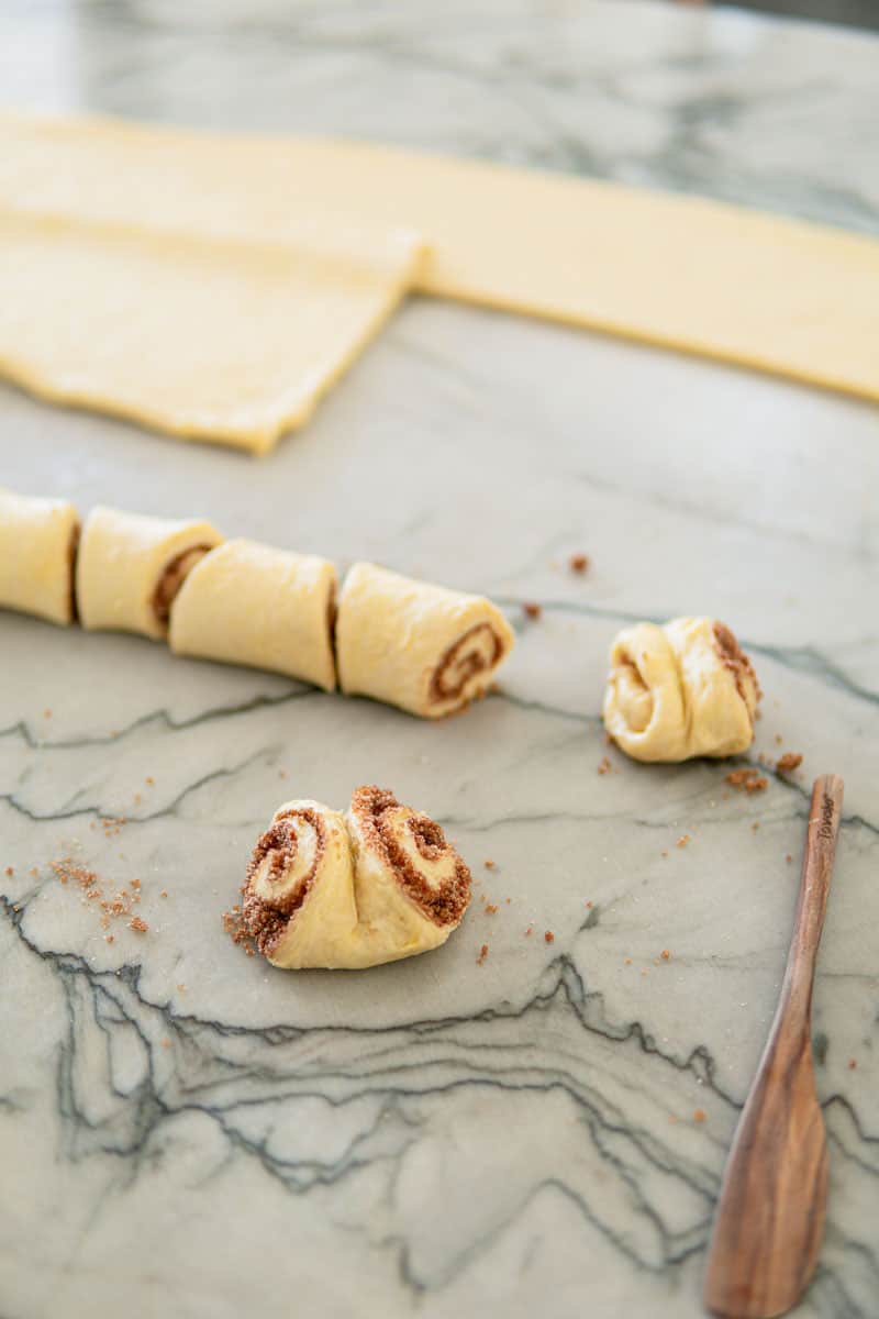 cutting and shaping German cinnamon rolls