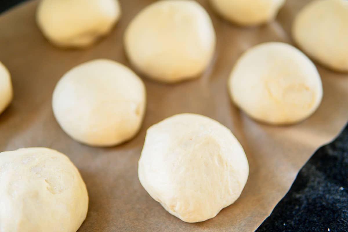 pretzel rolls on a baking sheet before baking