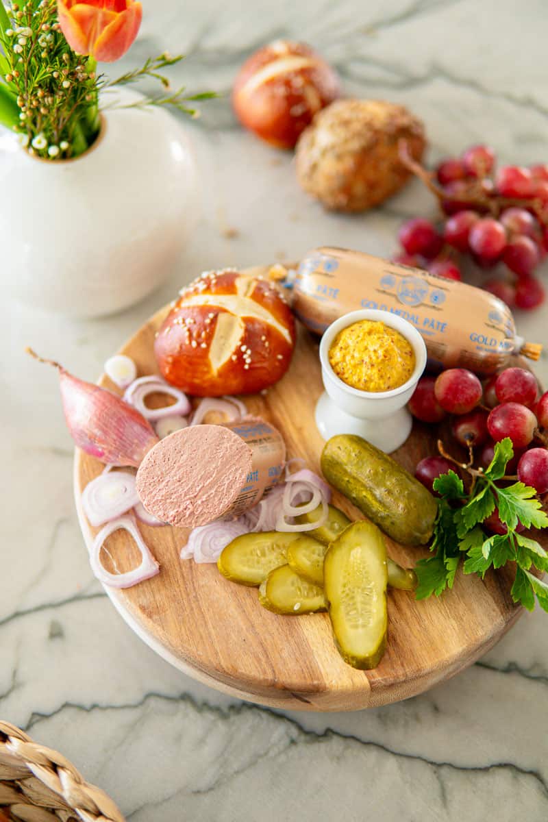 pretzel rolls with German meats and pickles