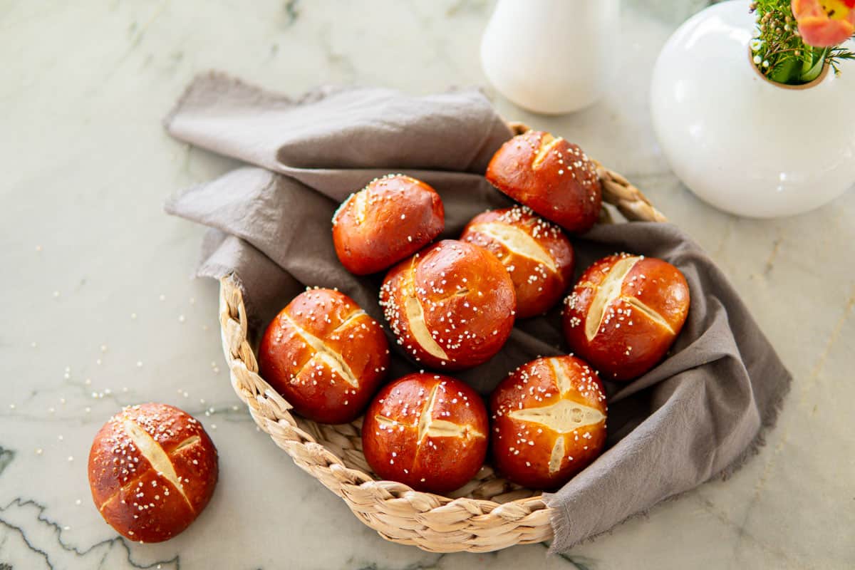 a basket filled with German pretzel buns