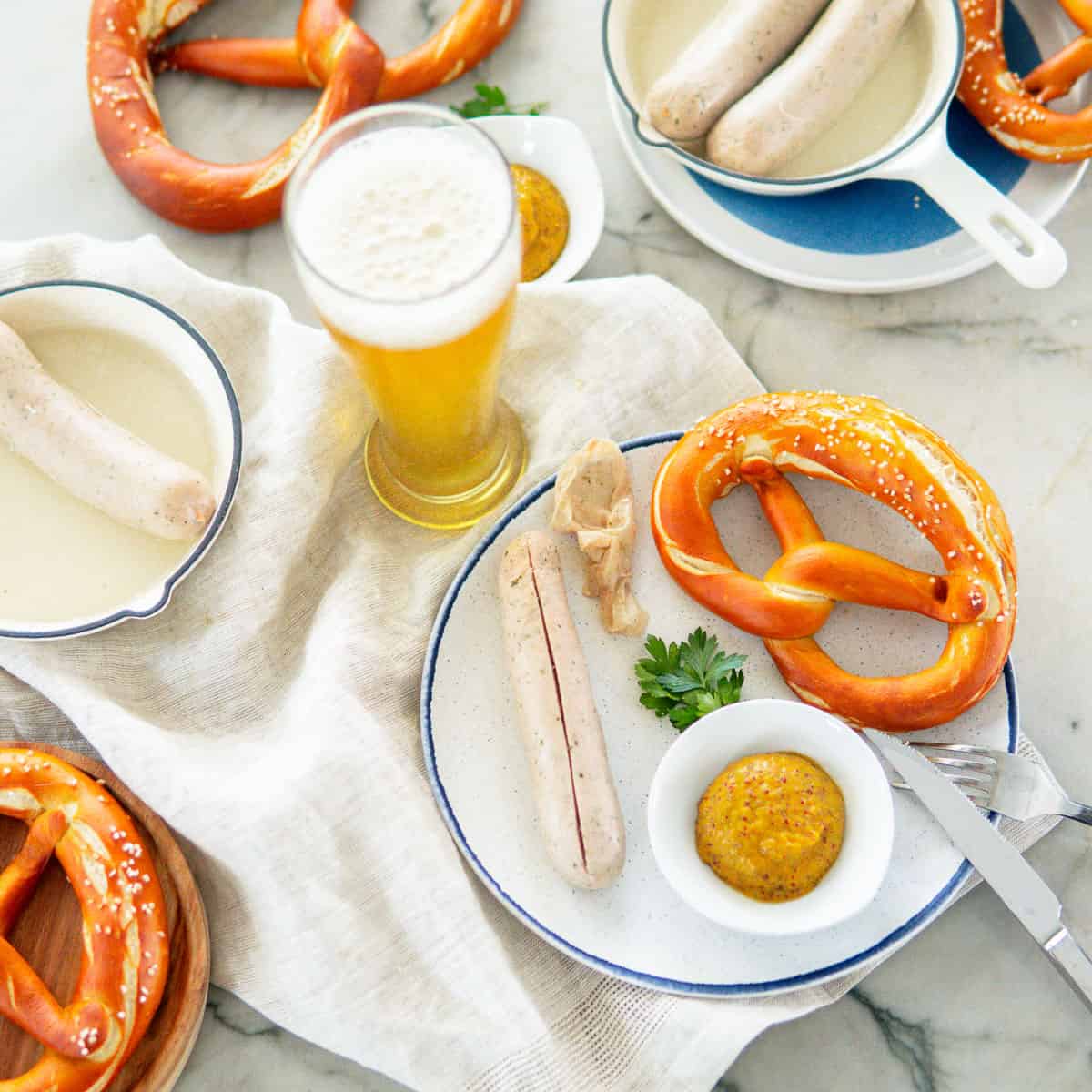 Weisswurst with sweet mustard, pretzel and Weissbier