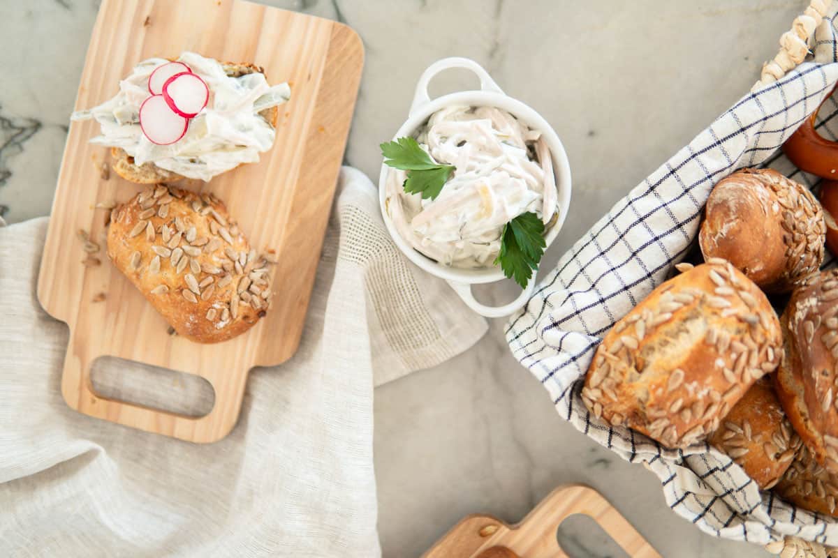 German meat salad in a dish and German breakfast rolls