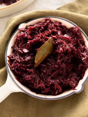 Authentic German red cabbage in a small white skillet.