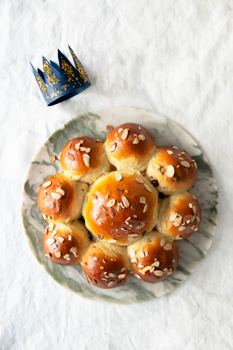 Swiss King's Cake with a paper crown on the side.