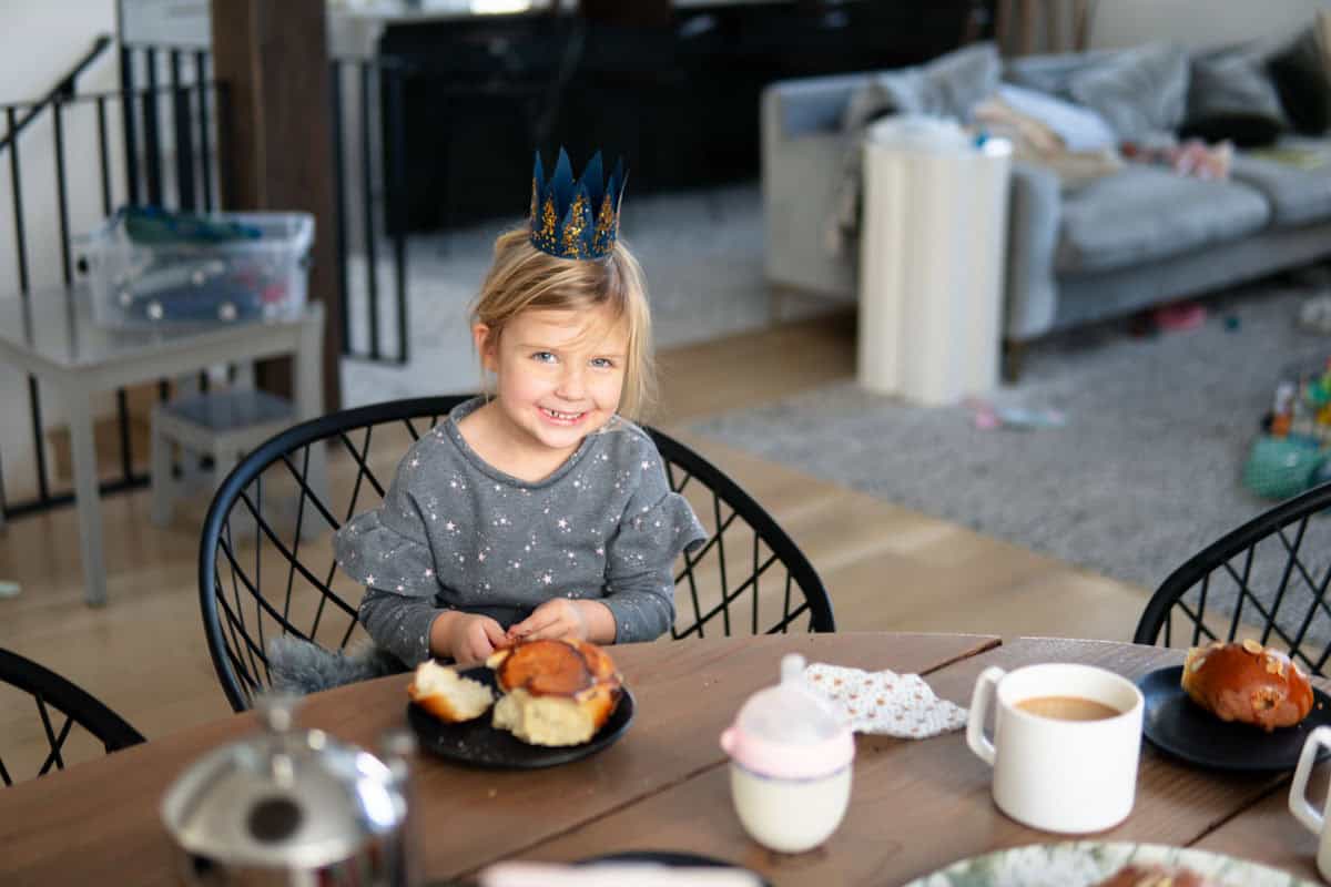 A girl wearing a paper crown for the Swiss Kings Day tradition.