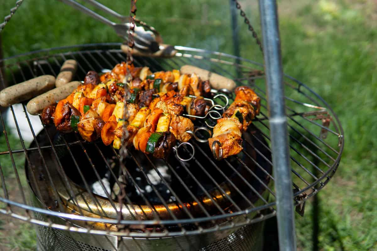 Chicken kabobs on a grill.