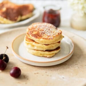 Closeup of a stack of fluffy German pancakes made with yeast.