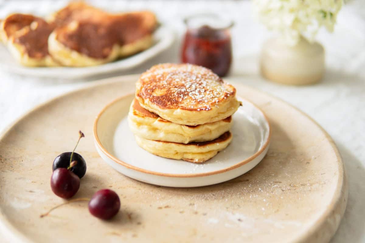 Closeup of a stack of fluffy German pancakes made with yeast.