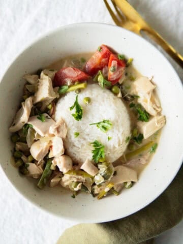 German stewed veggies and chicken over rice in a bowl.